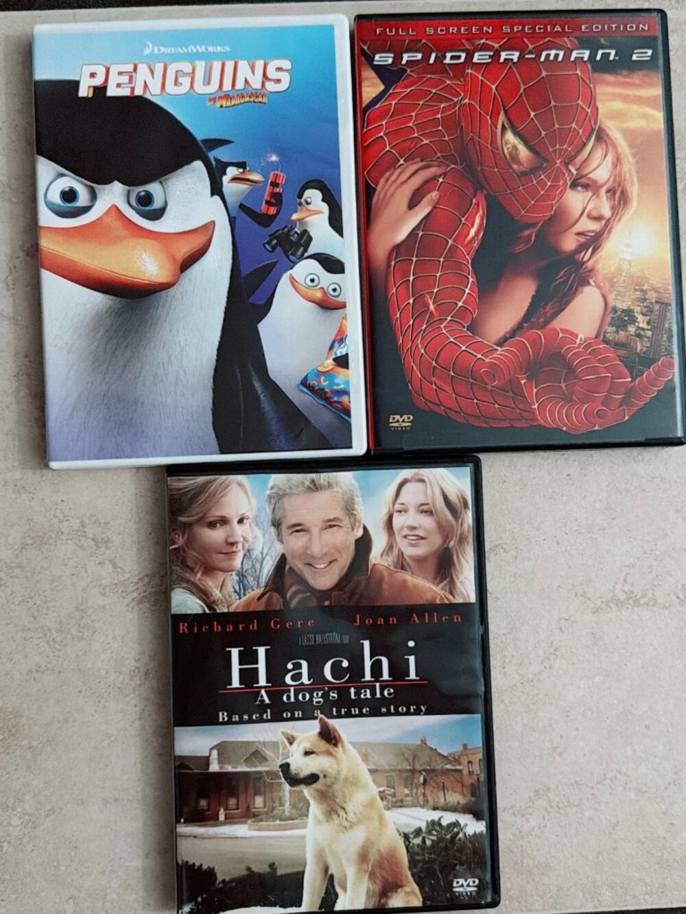 DVD Movie Lot of 3 - Penguins of Madagascar, Spider-Man 2, Hachi A Dog's Tale